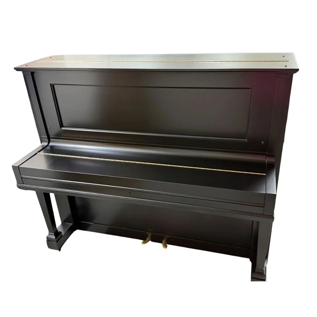 The satin-black case with the fallboard closed