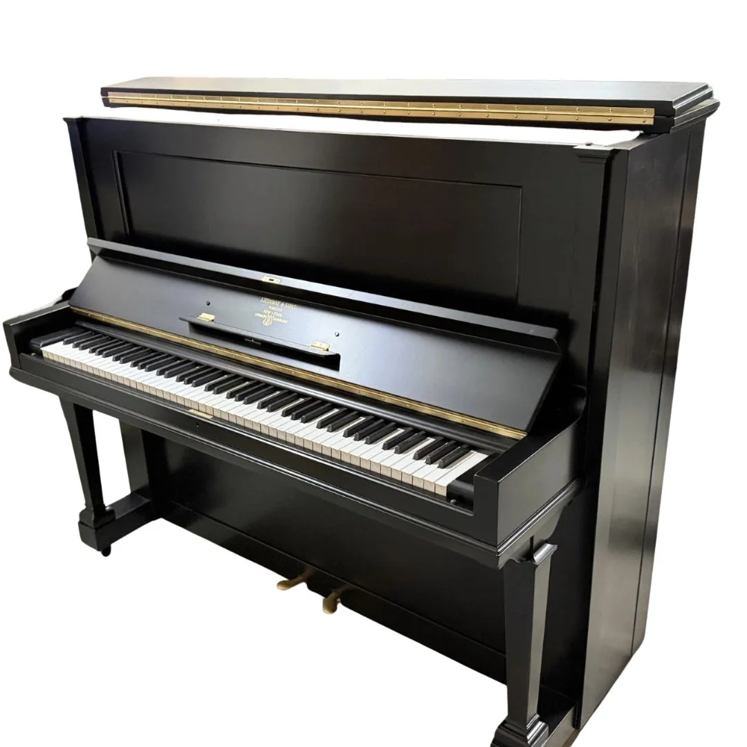 The restored 1911 Steinway & Sons upright in satin black, angled view with the keyboard open